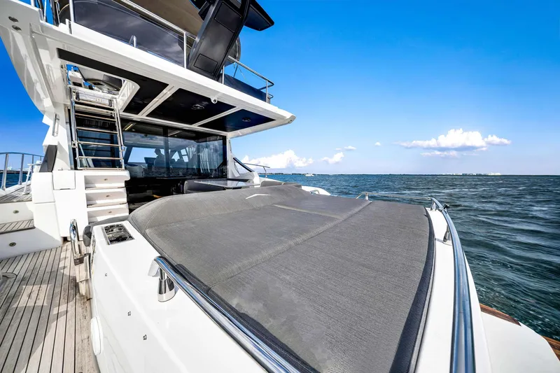 Amf Yacht Photos Pics 2021 Azimut S6 yacht on open water, showcasing luxurious deck and sleek design.