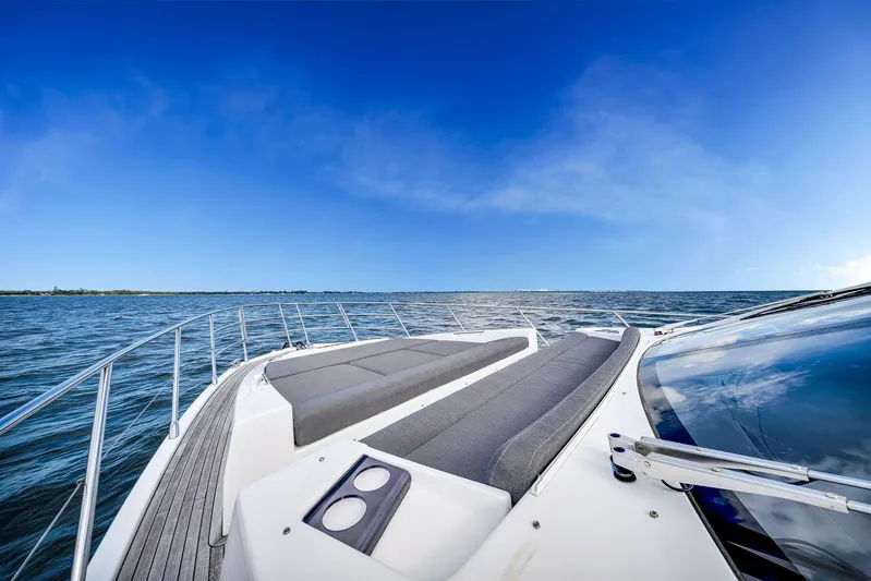 Amf Yacht Photos Pics Luxury Azimut S6 yacht deck with ocean view under clear blue sky.