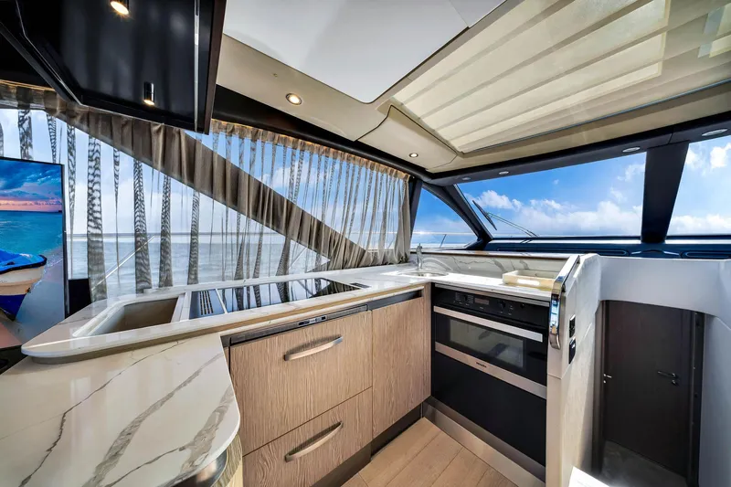 Amf Yacht Photos Pics Luxurious kitchen interior of 2021 Azimut S6 yacht with modern appliances and ocean view.