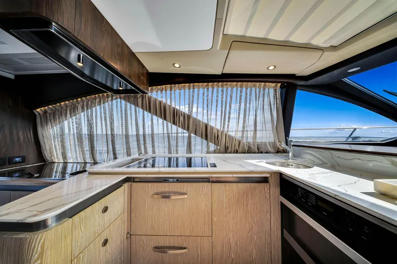 Amf Yacht Photos Pics Luxurious interior of 2021 Azimut S6 yacht with modern kitchen and ocean view.