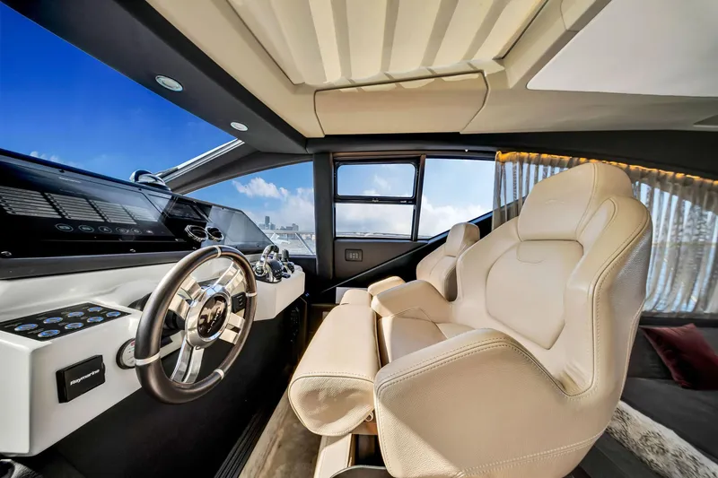 Amf Yacht Photos Pics Luxurious interior of 2021 Azimut S6 yacht with modern steering and plush seating.