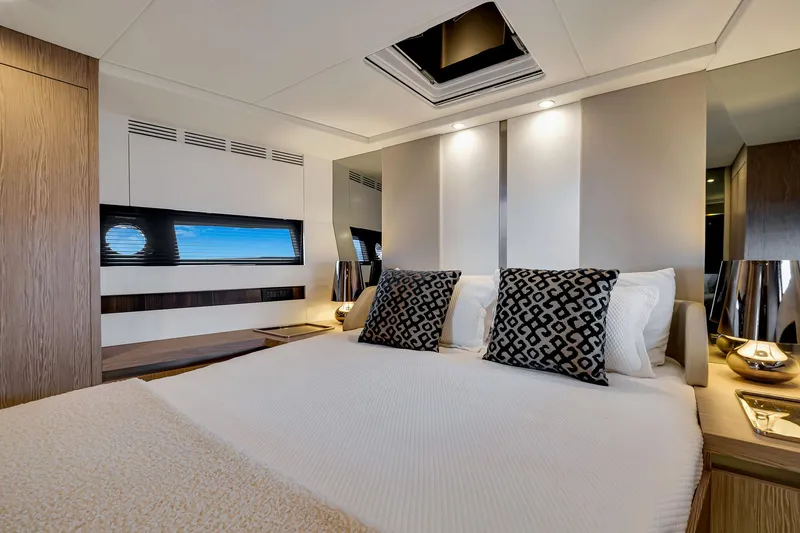 Amf Yacht Photos Pics Luxurious bedroom interior of 2021 Azimut S6 yacht with modern decor and elegant lighting.
