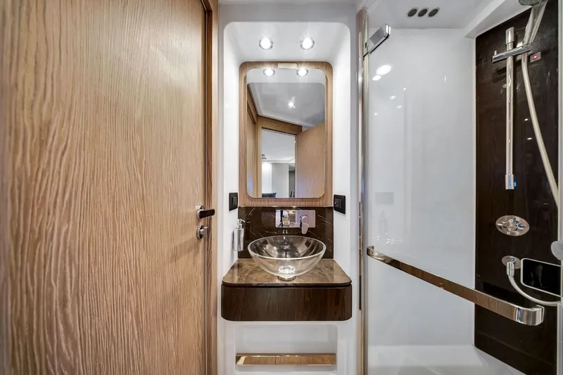 Amf Yacht Photos Pics Luxurious bathroom interior of 2021 Azimut S6 yacht with modern fixtures and elegant design.
