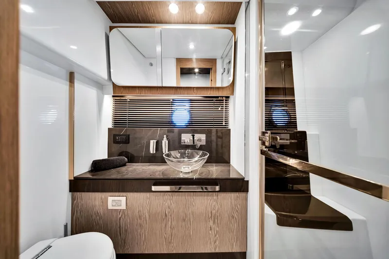 Amf Yacht Photos Pics Luxurious bathroom interior of 2021 Azimut S6 yacht with modern fixtures and elegant design.