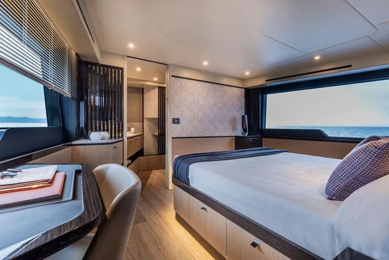 Absolute 56 Fly Yacht Photos Pics Luxurious bedroom interior of 2025 Absolute 56 FLY yacht with ocean view.
