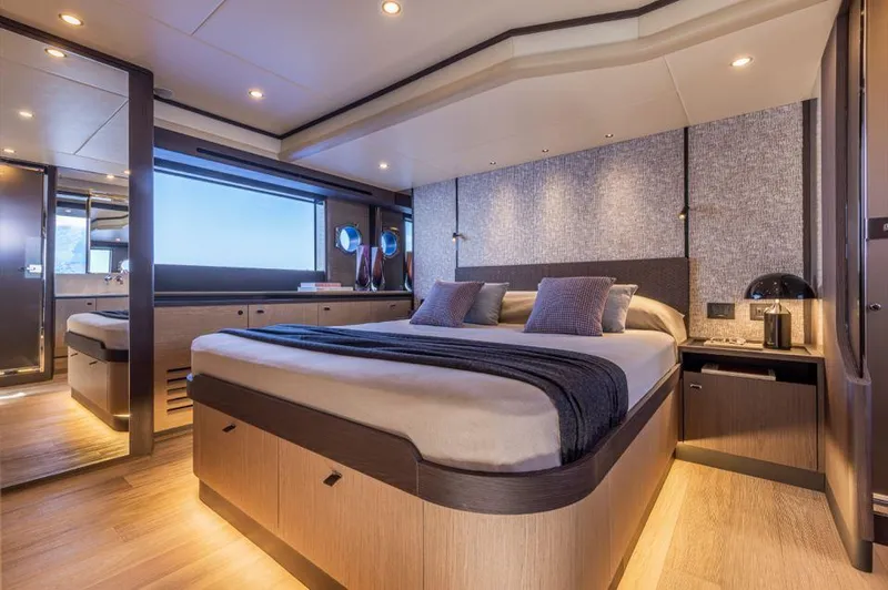 Absolute 56 Fly Yacht Photos Pics Luxurious bedroom interior of 2025 Absolute 56 FLY yacht, featuring modern design and ambient lighting.