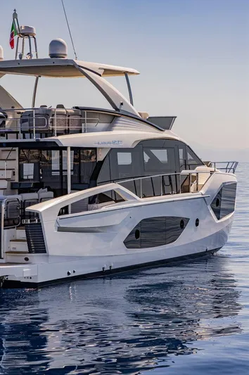 Absolute 56 Fly Yacht Photos Pics 2025 Absolute 56 FLY yacht on calm sea, showcasing sleek design and luxury features.