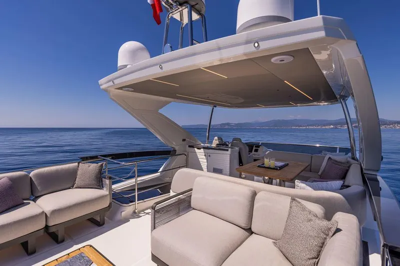 Absolute 56 Fly Yacht Photos Pics Luxury Absolute 56 FLY yacht deck with elegant seating, ocean view, 2025 model.