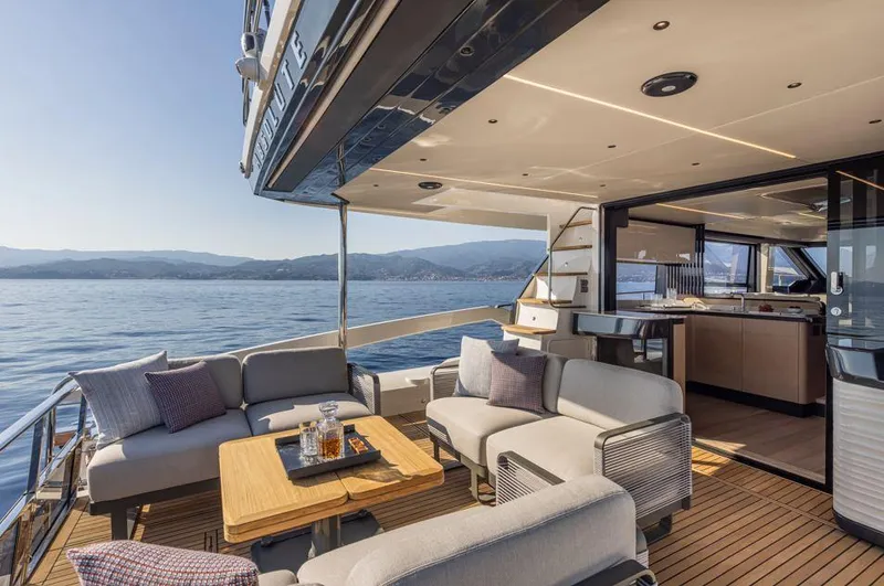 Absolute 56 Fly Yacht Photos Pics Luxurious Absolute 56 FLY yacht deck with modern seating, ocean view, and elegant interior, 2025 model.