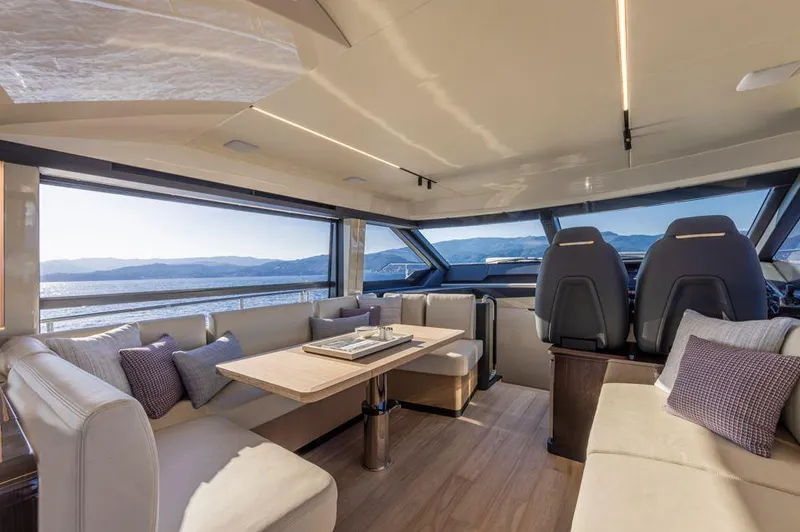 Absolute 56 Fly Yacht Photos Pics Luxurious interior of 2025 Absolute 56 FLY yacht with panoramic windows and elegant seating.