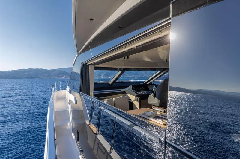 Absolute 56 Fly Yacht Photos Pics Luxurious Absolute 56 FLY yacht cruising on open sea, 2025 model, with sleek design and modern interior.