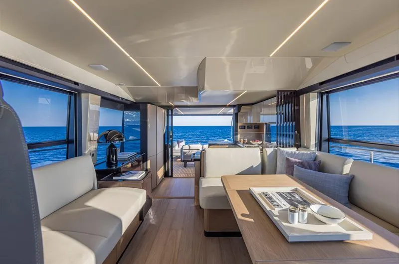 Absolute 56 Fly Yacht Photos Pics Luxurious interior of 2025 Absolute 56 FLY yacht with ocean view and modern furnishings.