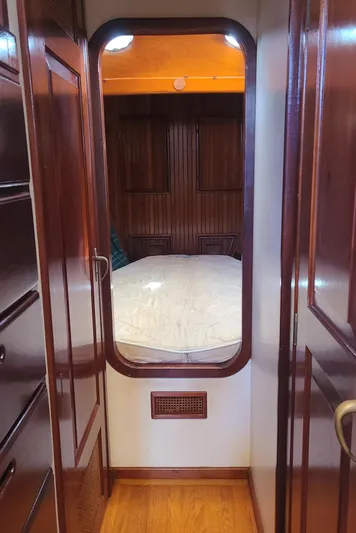 Chantey II Yacht Photos Pics Interior of 1989 Covey Island 48 Motorsailor with wooden paneling and cozy cabin.