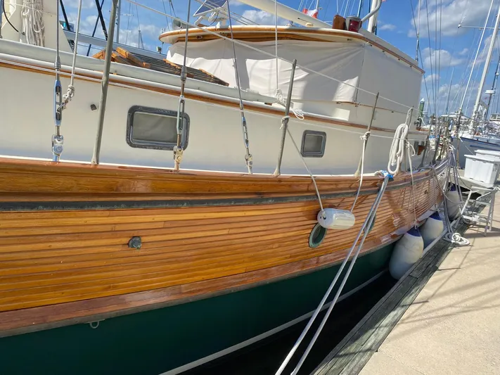 Chantey II Yacht Photos Pics 1989 Covey Island 48 Motorsailor docked, showcasing wooden hull and classic design.
