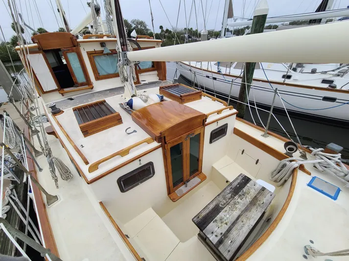 Chantey II Yacht Photos Pics 1989 Covey Island 48 Motorsailor with wooden deck and cabin, docked at marina.