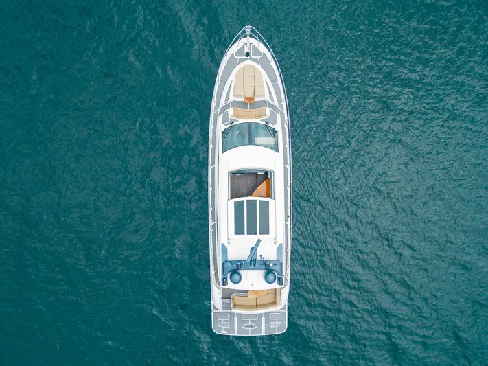 Lakehouse Yacht Photos Pics Aerial view of 2016 Sea Ray L590 yacht on blue ocean water.