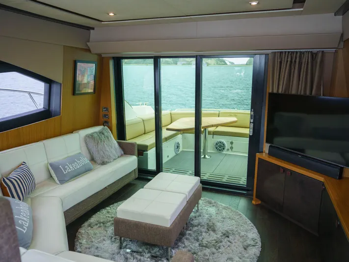 Lakehouse Yacht Photos Pics Luxurious interior of 2016 Sea Ray L590 yacht with modern furnishings and waterfront view.