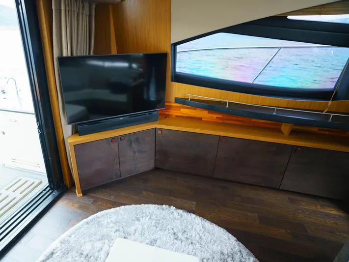 Lakehouse Yacht Photos Pics Luxurious interior of 2016 Sea Ray L590 yacht with TV and modern decor.