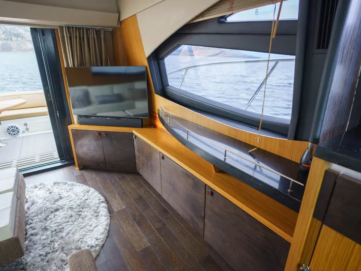 Lakehouse Yacht Photos Pics Luxurious interior of 2016 Sea Ray L590 yacht with modern furnishings and large windows.