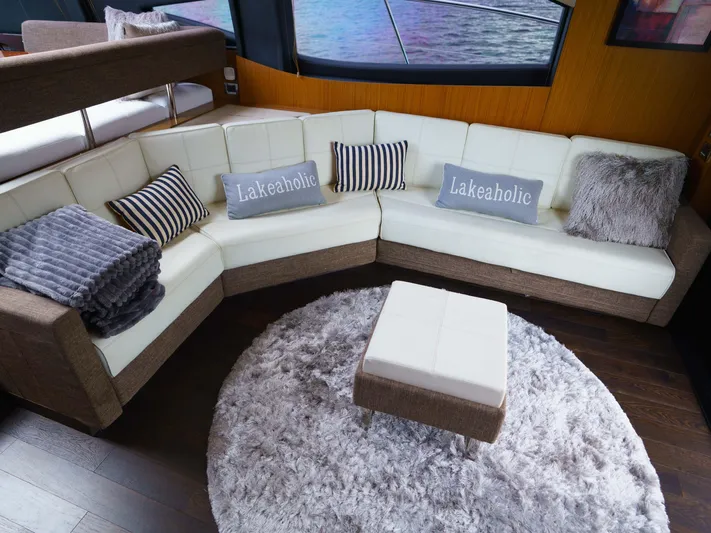 Lakehouse Yacht Photos Pics Luxurious 2016 Sea Ray L590 yacht interior with plush seating and decorative pillows.