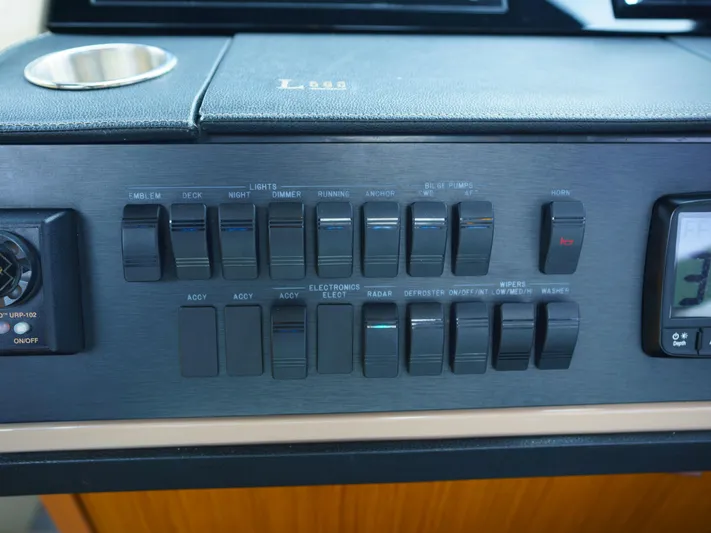 Lakehouse Yacht Photos Pics Control panel of a 2016 Sea Ray L590 yacht with various switches and dials.