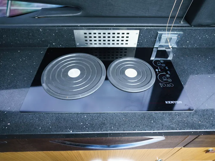 Lakehouse Yacht Photos Pics Modern Kenyon stovetop on 2016 Sea Ray L590 yacht kitchen counter.