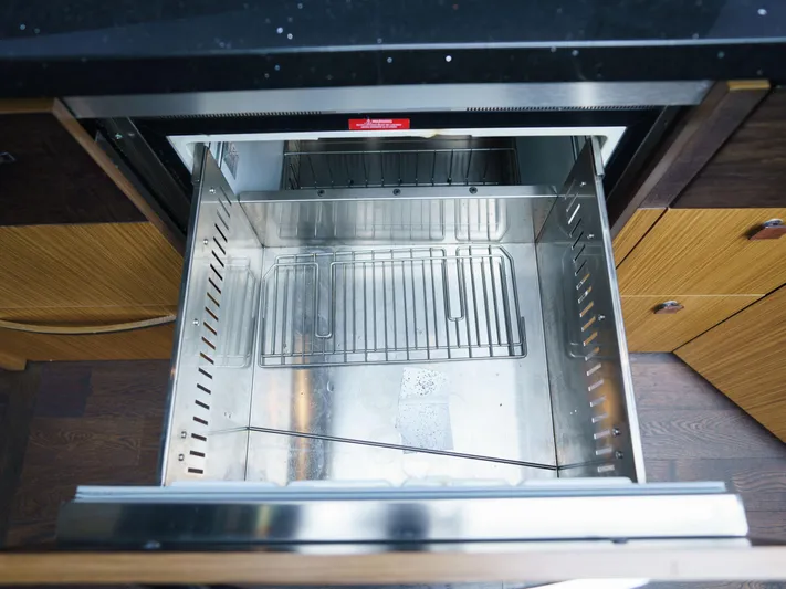 Lakehouse Yacht Photos Pics Open stainless steel drawer in 2016 Sea Ray L590 yacht kitchen.