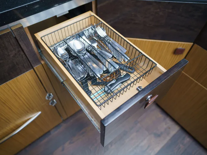 Lakehouse Yacht Photos Pics Open kitchen drawer with cutlery organizer on a 2016 Sea Ray L590 yacht.