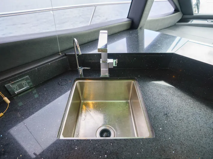 Lakehouse Yacht Photos Pics Luxury yacht kitchen sink with modern faucet, Sea Ray L590, 2016 model.