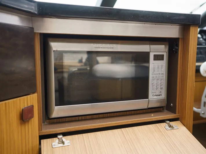 Lakehouse Yacht Photos Pics Built-in microwave in 2016 Sea Ray L590 yacht kitchen.