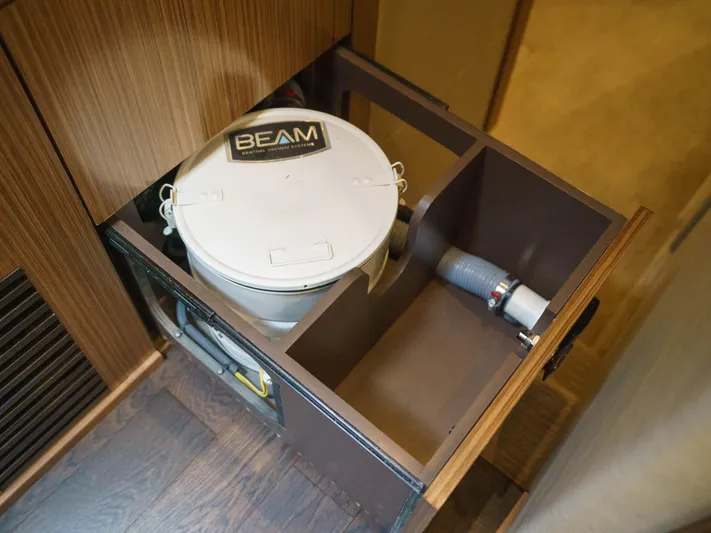 Lakehouse Yacht Photos Pics Central vacuum system in 2016 Sea Ray L590 yacht interior.