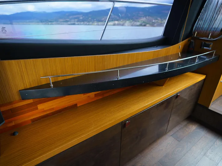 Lakehouse Yacht Photos Pics Luxurious interior of 2016 Sea Ray L590 yacht with sleek wooden cabinetry and modern design.