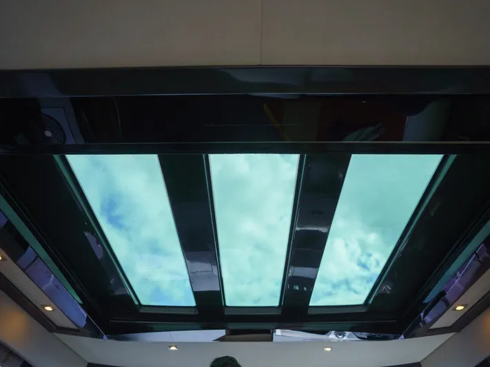 Lakehouse Yacht Photos Pics Skylight view from 2016 Sea Ray L590 yacht, showcasing a clear sky.