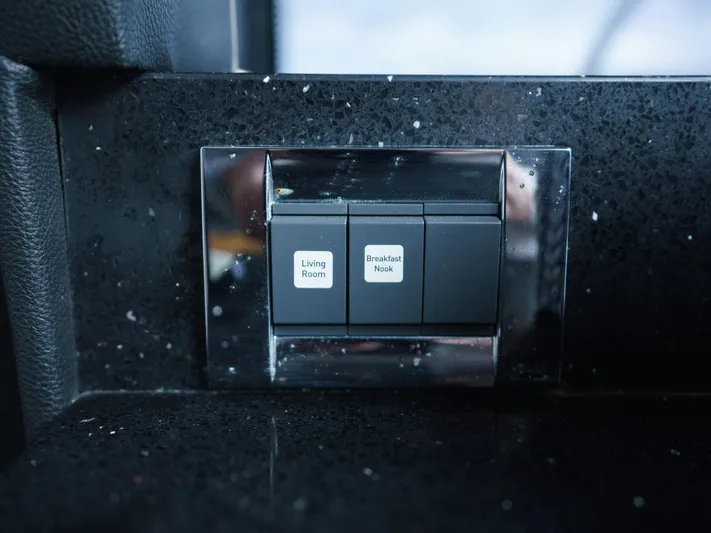 Lakehouse Yacht Photos Pics Control panel on 2016 Sea Ray L590 yacht, featuring living room and breakfast nook switches.