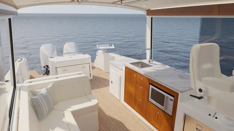  Yacht Photos Pics Luxurious 2026 MJM 38R yacht interior with modern kitchen and seating, overlooking serene ocean.