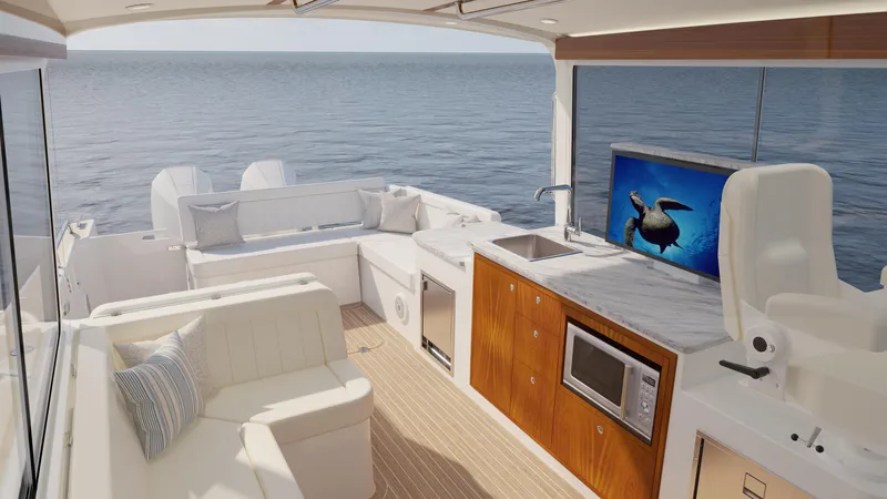  Yacht Photos Pics Luxurious 2026 MJM 38R yacht interior with seating, kitchenette, and ocean view.