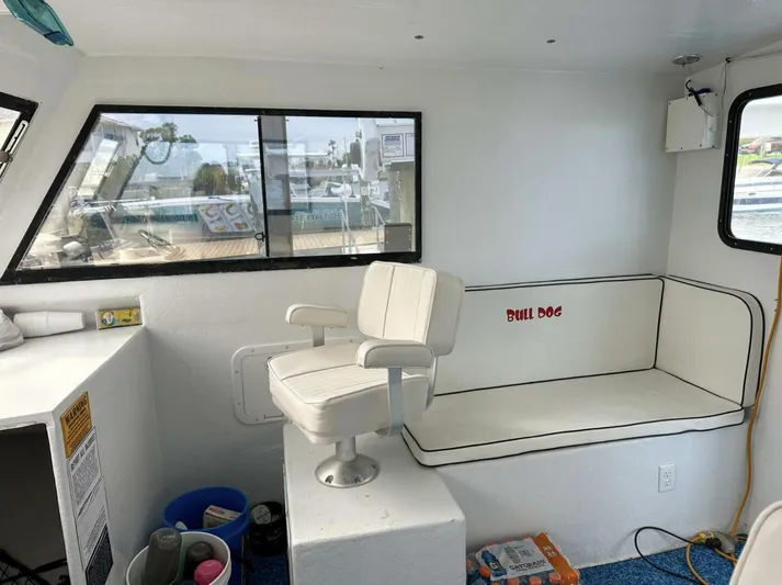  Yacht Photos Pics Interior of 1993 Crusader Boats 34 with seating and window view.