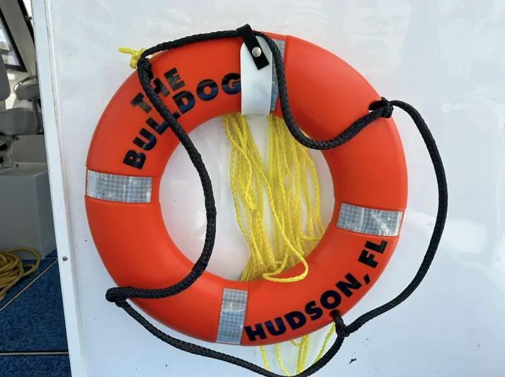  Yacht Photos Pics Orange life ring on Crusader Boats 34, 1993 model, labeled "The Bulldog, Hudson, FL."