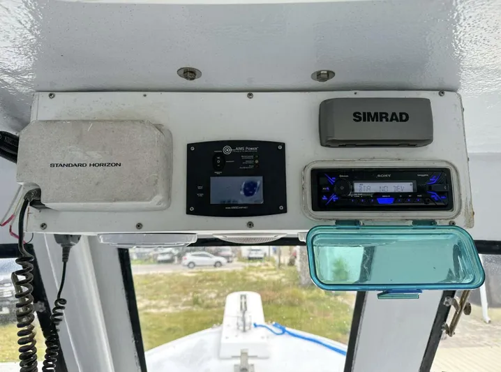  Yacht Photos Pics 1993 Crusader Boats 34 dashboard with Standard Horizon, Simrad, and marine electronics.