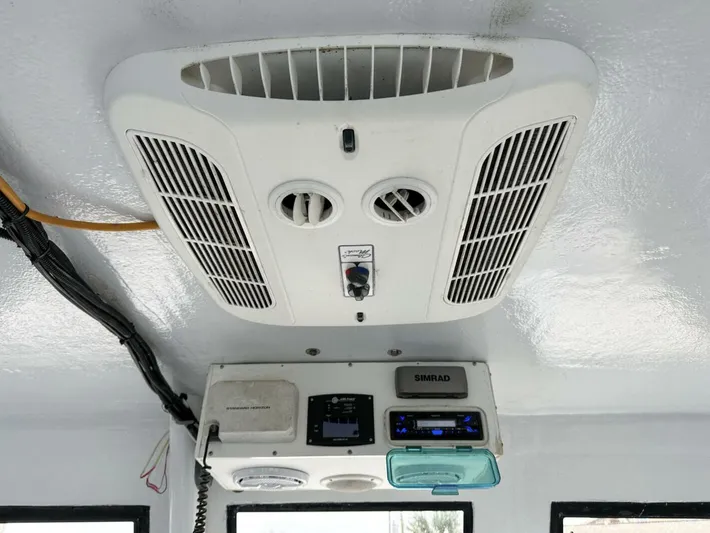  Yacht Photos Pics Ceiling-mounted air conditioning unit in a 1993 Crusader Boats 34 cabin.