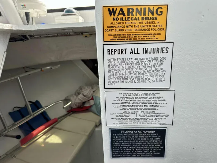  Yacht Photos Pics 1993 Crusader Boats 34 interior with safety warning and injury report notices.