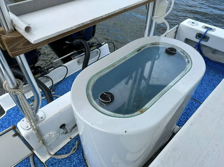  Yacht Photos Pics Livewell on 1993 Crusader Boats 34, featuring blue deck and fishing equipment.