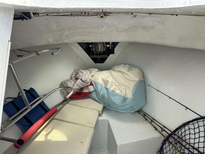  Yacht Photos Pics Interior of 1993 Crusader Boats 34, featuring storage and seating area.