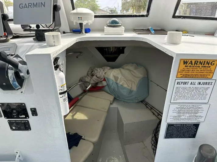  Yacht Photos Pics 1993 Crusader Boats 34 cabin interior with safety equipment and warning signs.