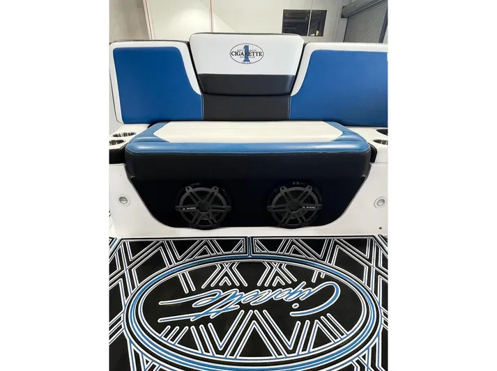  Yacht Photos Pics 2018 Cigarette GTO boat interior with blue and white seating and custom flooring.