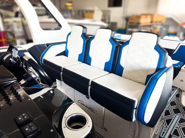  Yacht Photos Pics Luxury seating in a 2018 Cigarette GTO boat with blue and white upholstery.