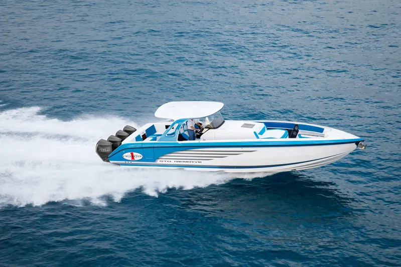  Yacht Photos Pics 2018 Cigarette GTO speedboat cruising on open water, showcasing sleek design and powerful engines.