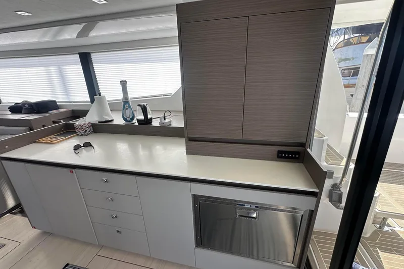 Hamlet Yacht Photos Pics Modern kitchen area in a 2023 Leopard 46PC yacht with sleek cabinetry and appliances.