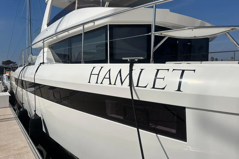 Hamlet Yacht Photos Pics 2023 Leopard 46PC yacht named "Hamlet" docked at a marina.