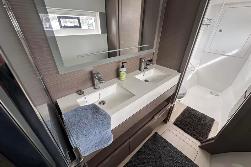 Hamlet Yacht Photos Pics Modern bathroom in 2023 Leopard 46PC yacht with dual sinks and shower.
